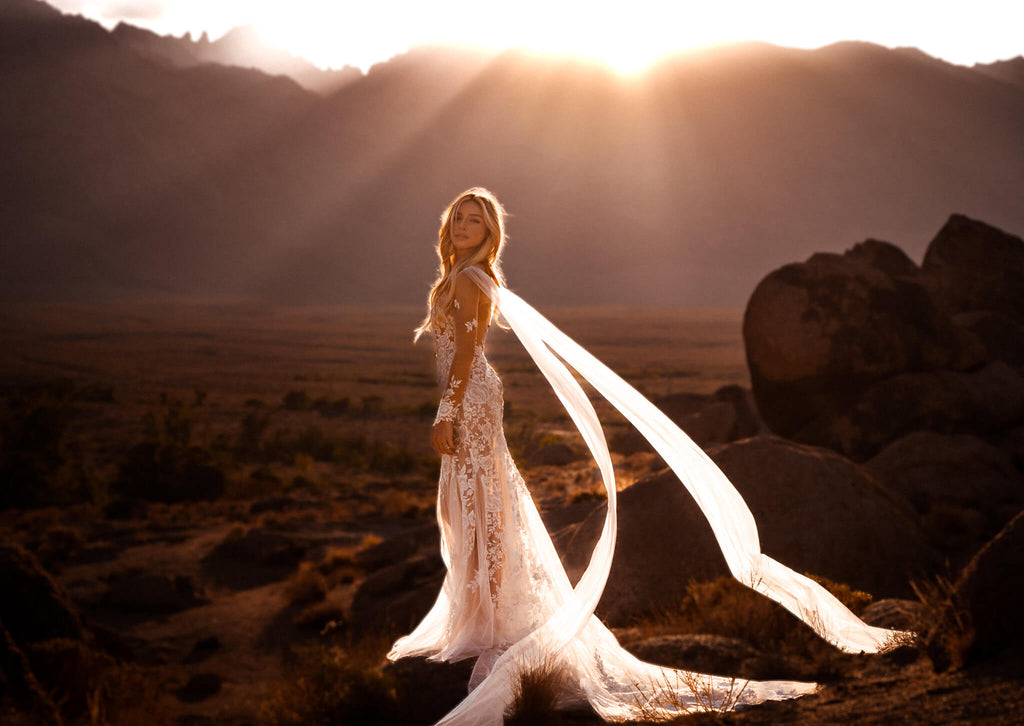 ILLUSION LACE WEDDING DRESS WITH ANGEL CAPE WINGS DURING GOLDEN HOUR